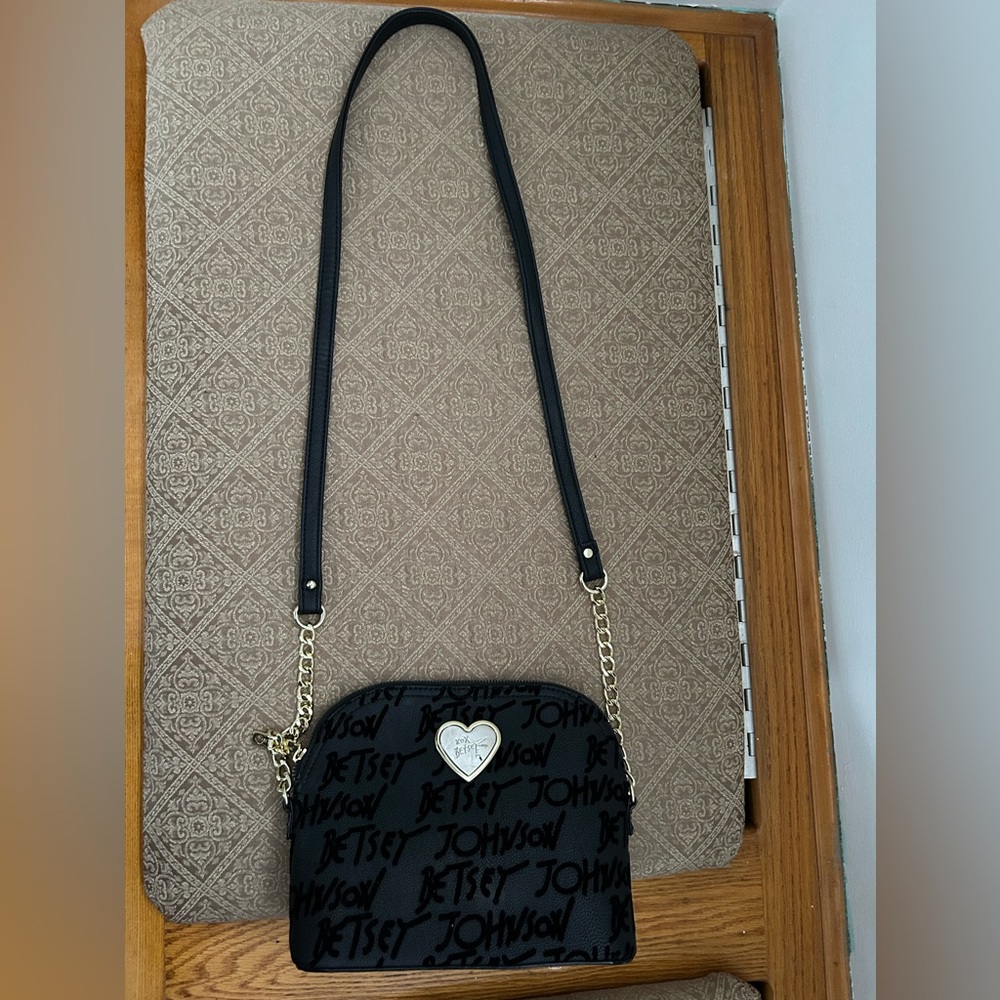 Used Betsey Johnson bag with top zip closure and outside velvet feeling letters